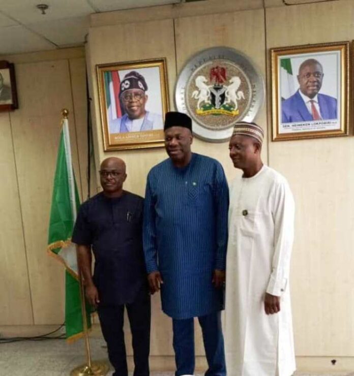 FG Inaugurates Technical Working Group The Permanent Secretary MPR, Amb. Nicholas Agbo Ella (centre) flanked by the Chairman of NGEP, Prof. Mohammed Ibrahim (right) and Director (Planning, Research and Statistics) NDE Mr. Onwuliri Edmund in a group photograph at the inauguration ceremony.