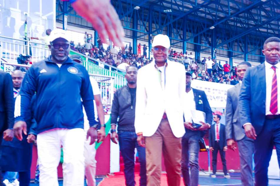 From R- L. The Honourable Minister of Sports Development, Sen. John Owan Enoh and the Governor of Delta State; RT Hon. (Elder) Sheriff Oborevwori during the match past by all the 36 States and FCT