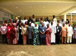 The HCSF, Mrs Didi Esther Walson-Jack, OON, mni in a group photograph with Federal Permanent Secretaries, at the Opening Ceremony of the Retreat, in Niger State.