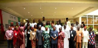 The HCSF, Mrs Didi Esther Walson-Jack, OON, mni in a group photograph with Federal Permanent Secretaries, at the Opening Ceremony of the Retreat, in Niger State.