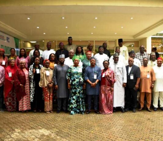 The HCSF, Mrs Didi Esther Walson-Jack, OON, mni in a group photograph with Federal Permanent Secretaries, at the Opening Ceremony of the Retreat, in Niger State.