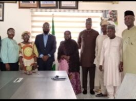 The Acting Executive Director, NIWRMC, Mrs Sakinatu Abbo Jimeta (M), Management Staff of the Commission and representatives of Nigerian Breweries PLC in a group photograph