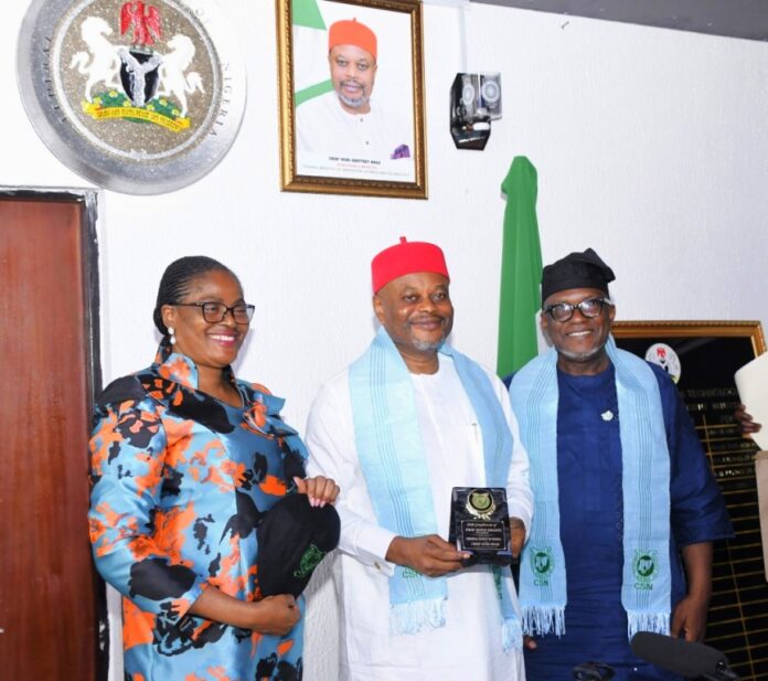 Nnaji Hon. Minister of Innovation, Science and Technology, Chief Uche Geoffrey Nnaji (middle) President, Chemical Society of Nigeria (CSN), Prof. Rufus Sha’Ato (right) Permanent Secretary of the Ministry, Mrs. Esuabana Nko Asanye (left), during the presentation of plaque to the Hon. Minister after decorating him as an honorary fellow of the Society in his office in Abuja.