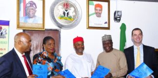 Minister of Innovation, Science and Technology, Chief Uche Geoffrey Nnaji (middle), Permanent Secretary of the Ministry, Mrs. Esuabana Nko Asanye (2nd left) Director, Legal Services Department FMIST, Mr. Tanko Ashang SAN, (left) Director-General, National Biotechnology Research and Development Agency Prof. Mustapha Abdullahi (2nd right) and Chief Executive Officer Flux, Mr. Sam Davies (right) during the display of the Signed Memorandum of Understanding (MoU) Between the Ministry and Flux Carbon, today in Abuja.