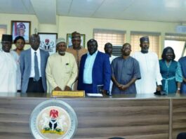 Front row,(Middle) Representative of RMAFC Chairman, Engr. Muhammed Sanni Baba, 2nd right, Dr. Abayomi Taofik Alaga, and others in a group photograph.