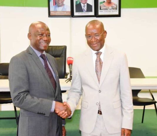 Hon. Minister of Sport Development, Sen. John Owan Enoh, in a handshake with the Chairman of Investigative committee on the various negative exposure to the country at the Paris 2024 Olympics and Paralympic Games, Dr. Mumini Alao, after the inauguration of the committee in Abuja on Wednesday, 25th September, 2024