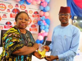 L-R: Mrs. Catherine Zosi, representative of the Permanent Secretary, Ministry of Interior and Mr. Emmanuel Attamah, representative of the Hon. Minister of Interior.
