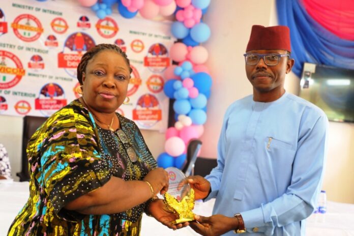 2024 Customer Service Week1 L-R: Mrs. Catherine Zosi, representative of the Permanent Secretary, Ministry of Interior and Mr. Emmanuel Attamah, representative of the Hon. Minister of Interior.