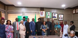 Group Photograph: Minister of Aviation and Aerospace Development Festus Keyamo SAN, CON, FCIArb. UK (Middle) wit DG. ICRC (Left) and staff of ICRC