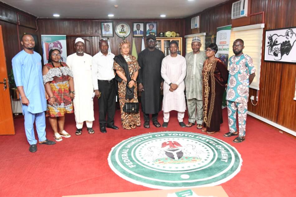 Minister of State for Youth Development, Comrade Ayodele Olawande, Management Staff of the Ministry and the Inaugurated members in a group photograph at the Minister of State office in Abuja.