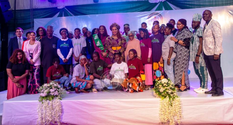 Honourable Minister of Women Affairs, Barrister (Mrs) Uju Kennedy-Ohanenye, FCT Mandate Secretary on Women Affairs, Dr. Adedayo Benjamin-Laniyi and other dignitaries in a pose with children at the event
