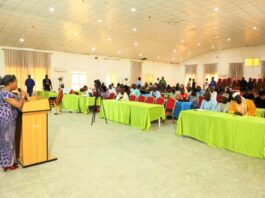Dr. Vivian Okono, Director Mines Environmental Compliance Department addressing Mineral Title Holders, Mining Host Communities & Relevant Stakeholders during a Sensitisation Workshop on behalf of the Permanent Secretary, Ministry of Solid Minerals Development