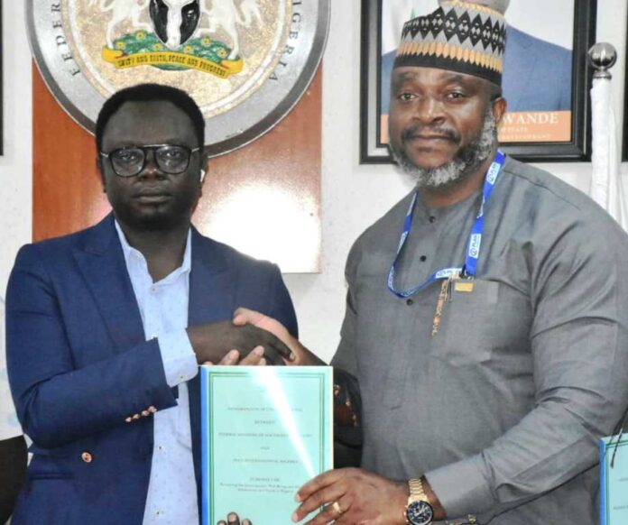 FG Signs MoU with Plan International1 Minister of State for Youth Development, Comrade Ayodele Olawande (L), with the Country Director, Plan International, Mr Charles Usie, during the signing of an MoU between the Ministry and Plan International at the Minister of State office in Abuja on Thursday (10/10/24).