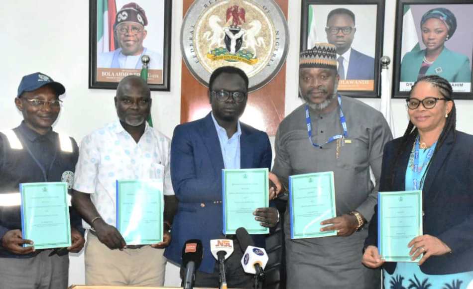 Minister of State for Youth Development, Comrade Ayodele Olawande (M); Country Director, Plan International, Mr Charles Usie (2nd R); with others during the signing of an MoU between the Ministry and Plan International at the Minister of State office in Abuja on Thursday (10/10/24).