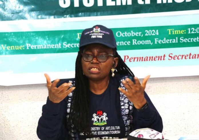 Federal Ministries of Arts Performance Management System (PMS)1 The Permanent Secretary of the Federal Ministry of Arts, Culture, and Creative Economy/Tourism, Ibiene Roberts, FNIM, OON, officially declaring open the Performance Management System (PMS).