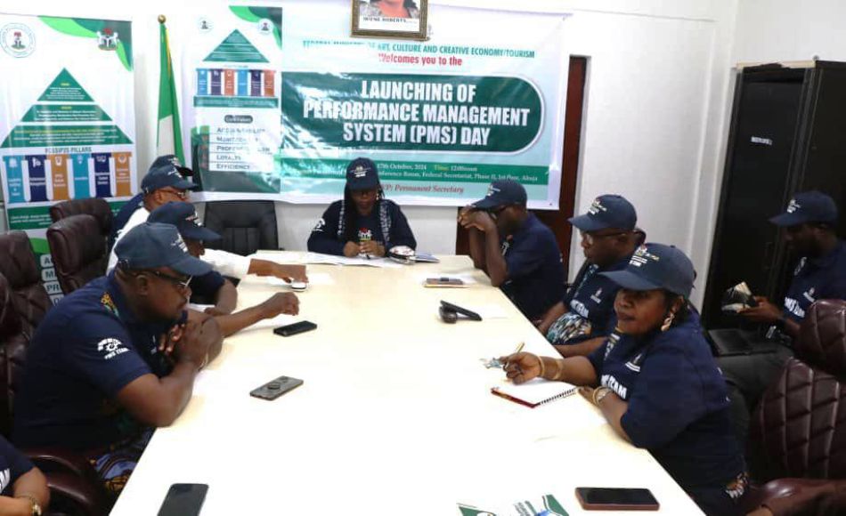 The Permanent Secretary of the Federal Ministry of Arts, Culture, and Creative Economy/Tourism, Ibiene Roberts, FNIM, OON alongside the Directors and staff, during the official launch of the Performance Management System (PMS).