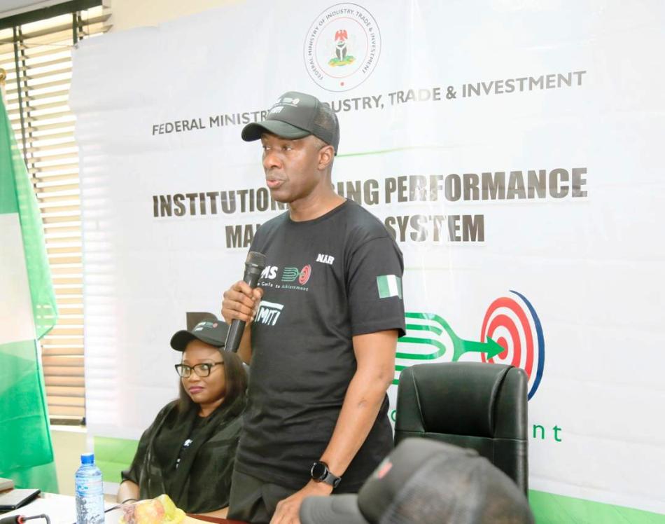 PS FMITI Amb Nura Abba Rimi (raddressing the gathering at the official launch of the Performance Management system at the Federal Ministry of Industry Trade and Investment today in Abuja. Seated by his side is the PS Livestock Delepment Ministry Dr Chinyere Akujobi