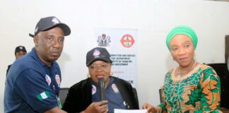 Ms Anietie Umoessien (middle) representing PS FMITI, Mrs Nnenna Akajemeli(right)National Coordinator and CEO of SERVICOM Presidency, delivering her speech to mark the Global Customer Service Week. and Mallam Nasiru Mohammed (left) listens to the SERVICOM CHIEF.