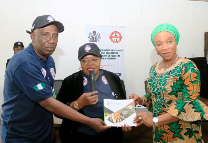 Global Customer Service Week3 Ms Anietie Umoessien (middle) representing PS FMITI, Mrs Nnenna Akajemeli(right)National Coordinator and CEO of SERVICOM Presidency, delivering her speech to mark the Global Customer Service Week. and Mallam Nasiru Mohammed (left) listens to the SERVICOM CHIEF.