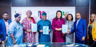 Group Photograph After The Signing of MoU between the Ministry, GCE HealthCare and JNCI: Middle: The Hon. Minister of State for Health & Social Welfare Dr. Tunji Alausa; on his right is the Permanent Secretary, Daju Kachollom mni; 2nd Left: Director Hospital Services Department Dr. Jimoh Salaudeen mni; on the Left of Hon. Minister is Mrs. Claire Omatseye, Managing Director JNCI .