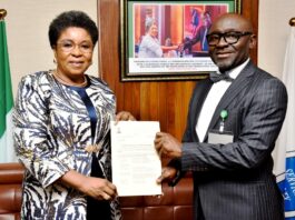 R-L: Mr Alfred Agaba Abah presenting his Letter of Appointment as SSAP to the Head of the Civil Service of the Federation, Mrs Didi Esther Walson-Jack, OON, mni.