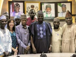 The Minister of State for Agriculture and Food Security, Sen Dr Aliyu Sabi Abdullahi (C), members of the National Tomato Grower's Processors and Marketers Association of Nigeria.