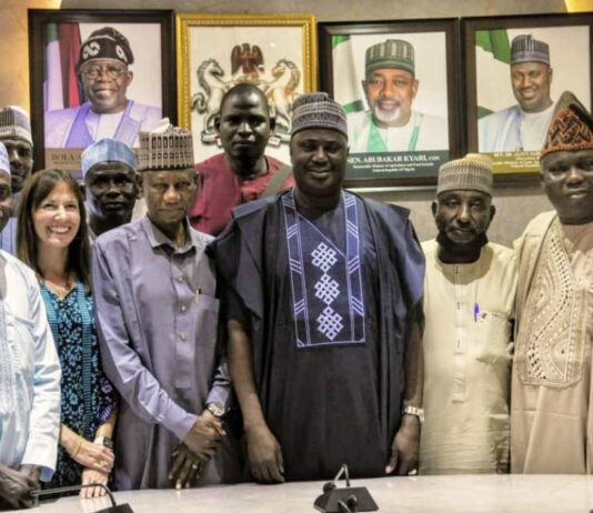 The Minister of State for Agriculture and Food Security, Sen Dr Aliyu Sabi Abdullahi (C), members of the National Tomato Grower's Processors and Marketers Association of Nigeria.