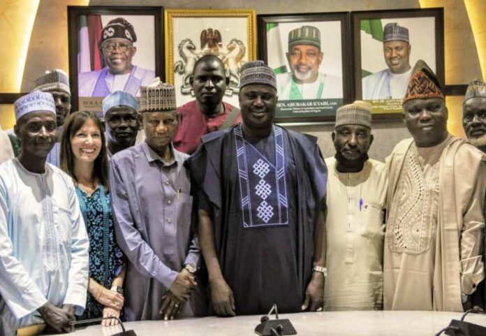 One Day Round Table On Tomato The Minister of State for Agriculture and Food Security, Sen Dr Aliyu Sabi Abdullahi (C), members of the National Tomato Grower's Processors and Marketers Association of Nigeria.