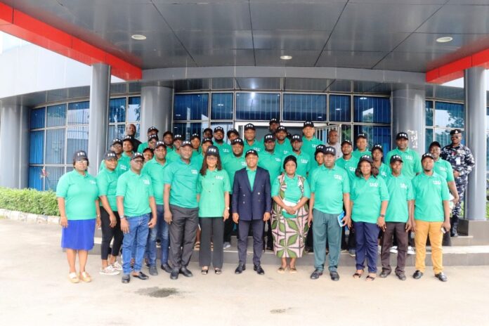 PMS Champions 5th from left, Ambassador Gabriel Aduda, Permanent Secretary, Federal Ministry of Women Affairs, in a group photograph with the Ministry's Performance Management System Core Team