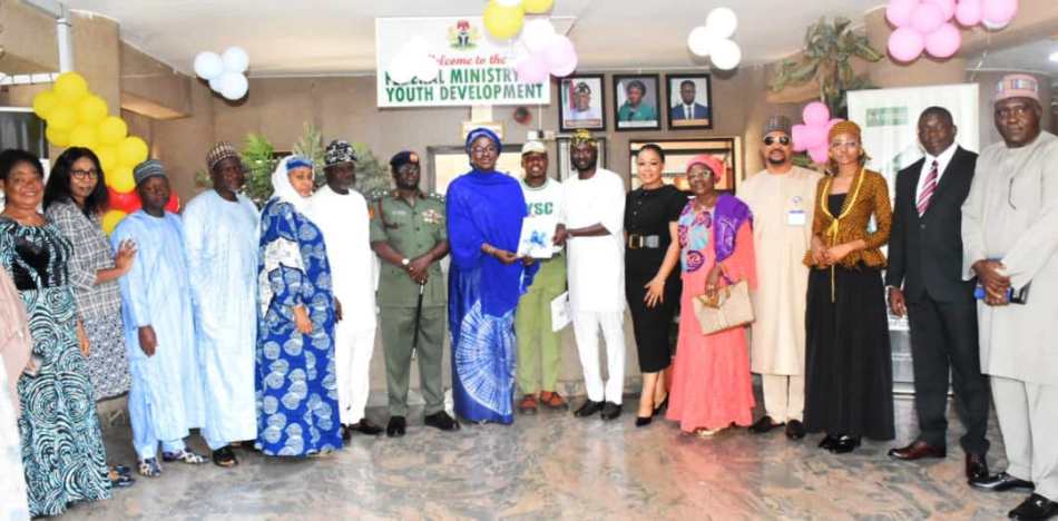 Minister of Youth Development, Dr Jamila Bio-Ibrahim (8th L); Director-General, National Youth Service Corps (NYSC), Brig. -Gen. Yusha'u Ahmed(7th L); Chairman of the NYSC Reforms Committee, Kabir Oyekunle(7th R); Deputy Chairman, NYSC Reforms Committee, Mrs Bintu Garba(5th R); and others, during the submission of the NYSC Reforms Committee report to the Minister in Abuja on Tuesday (8/10/24).