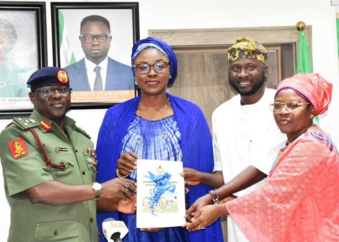 Reform of NYSC2 From left: Director-General, National Youth Service Corps (NYSC), Brig. -Gen. Yusha'u Ahmed; Minister of Youth Development, Dr Jamila Bio-Ibrahim; Chairman of the NYSC Reforms Committee, Kabir Oyekunle; and the Deputy Chairman, NYSC Reforms Committee, Mrs Bintu Garba, during the submission of the NYSC Reforms Committee report to the Minister in Abuja on Tuesday (8/10/24).
