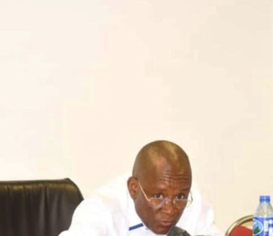 The Hon minister of sports Development,Sen John owan Enoh, at the inauguration of members of the ministerial Delivery committee