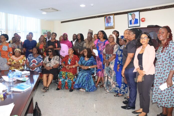 3rd left - Rep of the Honourable Minister, Women Affairs, Mrs Friya Bulus, Director, Legal - Mrs Chioma Ibe-Okafor, other Directors and participants at the Stakeholders planning meeting for the 16 days of Activism against GBV held yesterday in Abuja