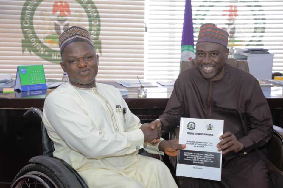 The Executive Secretary, National Commission for Persons with Disabilities, Chief Ayuba Gufwan with Dr. Suleiman HARUNA, federal ministry of Information and national orientation.