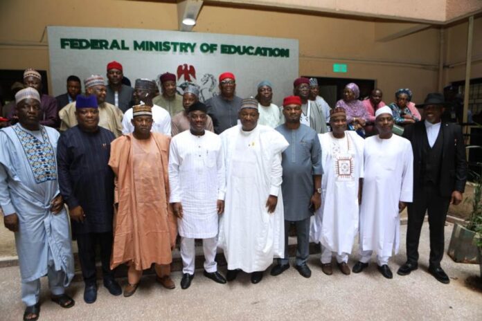 Building Education Together The group picture of the honourable Minister of Education Dr Morufu Olatunju Alausa wearing white cloth with black cap (to his L) the Senate Committee leader of tertiary Institutions Senator Munrari Danduts,( to his R)the Permanent Secretary Education Dr Nasir Sani-Gwarzo mni and other Committee members.