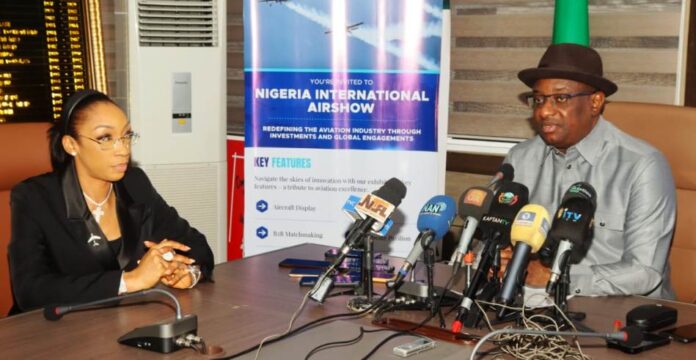 FG Set To Host NIA2 L-R: Chief Executive Officer of Nigeria International Airshow, Bria Williams listening to the Hon. Minister while delivering his Address at the event.