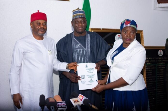 IMG-20241109-WA0001 Hon. Minister of Innovation, Science and Technology, Chief Uche Geoffrey Nnaji (left) Permanent Secretary of the Ministry, Mrs. Esuabana Nko Asanye (right) and President, Nutrition Society of Nigeria Prof. Salisu Maiwada Abubakar (2nd right) during the presentation of the signed Memorandum of Understanding (MoU) to the Hon. Minister in his office Abuja.