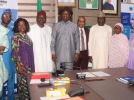 Hon, Minister, Ministry of Aviation and Aerospace Development and the Permanent Secretary in a group photograph. with retired Directors of the Ministry