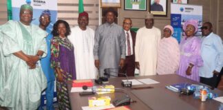 Hon, Minister, Ministry of Aviation and Aerospace Development and the Permanent Secretary in a group photograph. with retired Directors of the Ministry