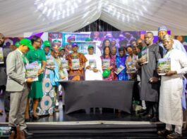 The Honourable Coordinating Minister for Health & Social Welfare Prof Muhammad Ali Pate launching the Nigeria Climate Change and Health Vulnerability Assessment Adaptation Report; on his right: Permanent Secretary Kachollom Daju mni; on her right is: Dr Okara Dogara, Technical Assistant to Permanent Secretary & other stakeholders/ participants at the JAR Conference.