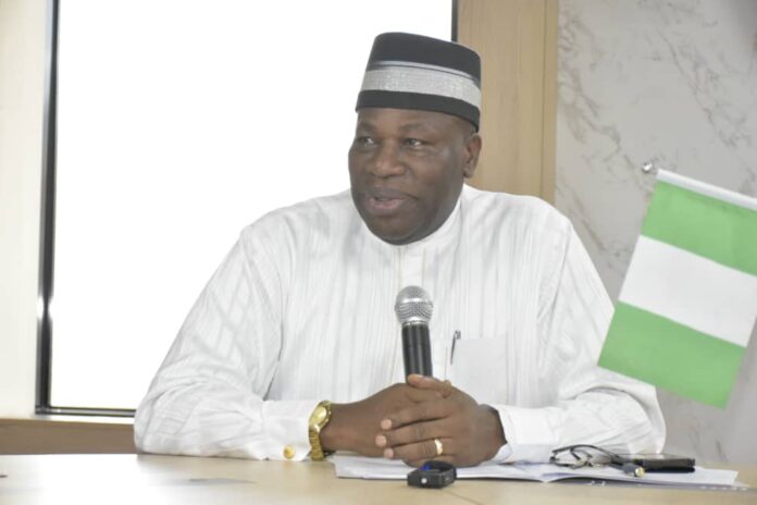 IMG-20241112-WA0152 Representative of the Honourable Minister of State Petroleum Resources (Gas) and Permanent Secretary, MPR. Amb. Nicholas Agbo Ella delivering his remarks at the official signing of partnership agreement between BFI Group and China National Chemical Engineering Corporation (CNCEC) in Abuja.