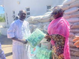 The Permanent Secretary, Dr. Maryam Ismaila Keshinro, handing over the relief materials to the representative of the Borno State Government.
