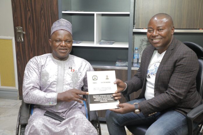 IMG-20241117-WA0057 The Executive Secretary, National Commission for Persons with disabilities, Chief Ayuba Gufwan with the CEO Suntech Sunny Okachukwu.
