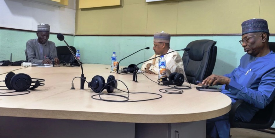 Hon. Minister of Information and National Orientation, Mohammed Idris, fnipr and the anchor of the programme “Hannu da Yawa” Buhari Auwalu (left), while Director-General, Federal Radio Corporation of Nigeria, Dr Mohammed Bulama is seated to the right.