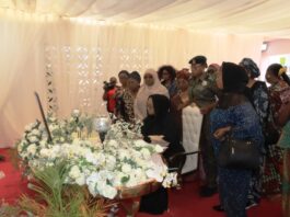 Honourable Minister of Women Affairs, Hajiya Imaan Sulaiman-Ibrahim, signing the Register when she led a delegation of Women Groups on Condolence Visit to the Wife of the Late Chief of Army Staff, Mrs. Mariya Abiodun Lagbaja. To her right is the D-G, MBNWDC, Dr. Asabe Bashir, Director, Women Development, Mrs. Friya Bulus and Director, Economic Services, Mrs. Blessing Anunike