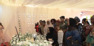 Honourable Minister of Women Affairs, Hajiya Imaan Sulaiman-Ibrahim, signing the Register when she led a delegation of Women Groups on Condolence Visit to the Wife of the Late Chief of Army Staff, Mrs. Mariya Abiodun Lagbaja. To her right is the D-G, MBNWDC, Dr. Asabe Bashir, Director, Women Development, Mrs. Friya Bulus and Director, Economic Services, Mrs. Blessing Anunike