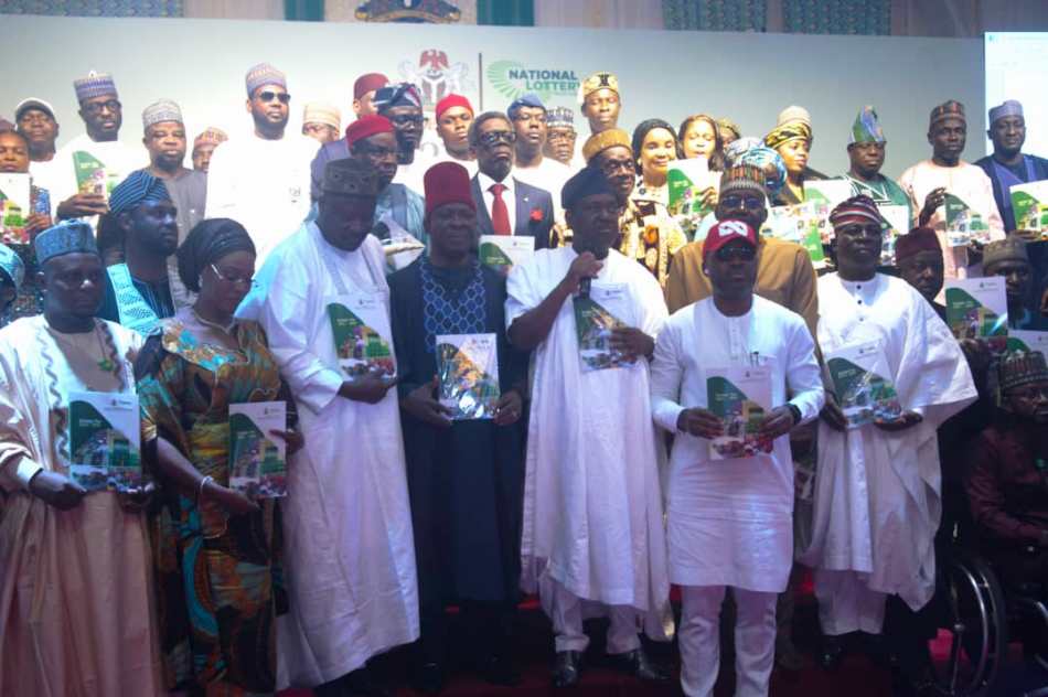 Cross section of dignitaries holding the Strategic document.