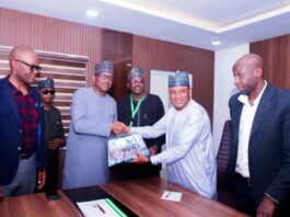 The President of Nigeria Universities Games Association (NUGA) Dr. Bawa Muhammed presenting souvenir to the Chairman of Nigeria Sports Commission, Mallam Shehu Dikko, during the Association's courtesy visit to the Chairman in his office recently in Abuja.