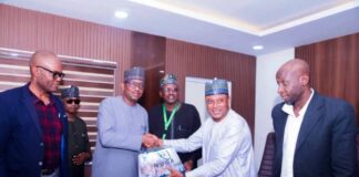The President of Nigeria Universities Games Association (NUGA) Dr. Bawa Muhammed presenting souvenir to the Chairman of Nigeria Sports Commission, Mallam Shehu Dikko, during the Association's courtesy visit to the Chairman in his office recently in Abuja.