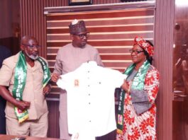 Chairman, National Sports Commission, Mallam Shehu Dikko being presented a uniform by the President of National Association of Physical health Education, Recreation Sports and Dance Prof. Florence Bola Adeyanju (Right) and Dr. Mohammed Sanusi, the National vice president of the Association, when they paid a congratulatory visit to the Chairman in his office, at MKO Abiola National Stadium, Abuja